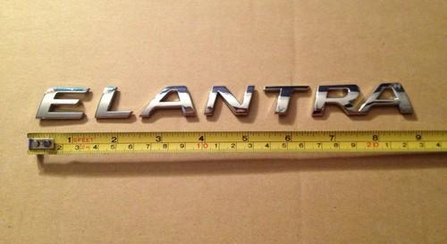 Used genuine oem rear "elantra" emblem for 2010-2013 hyundai elantra models