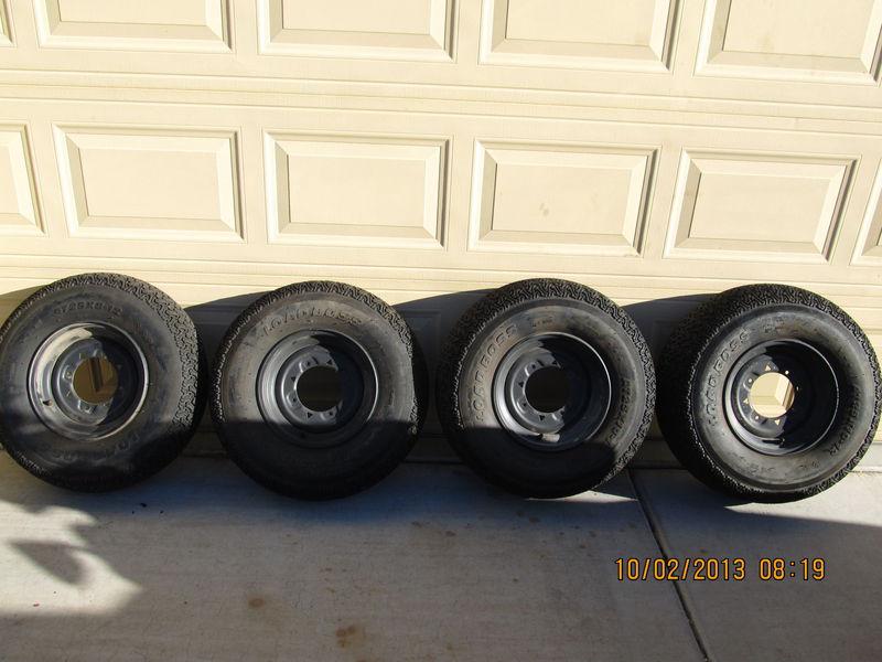 Load boss set of 4 dot tires with polaris rims . 2 at 25-10-12 and 2  at 25-8-12