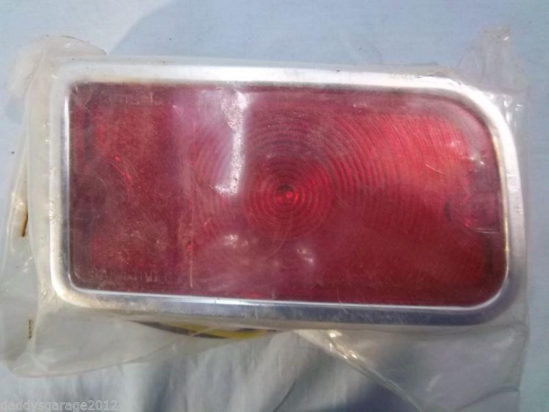 67 chevy wagon. nos tail light assembly. sealed in original package