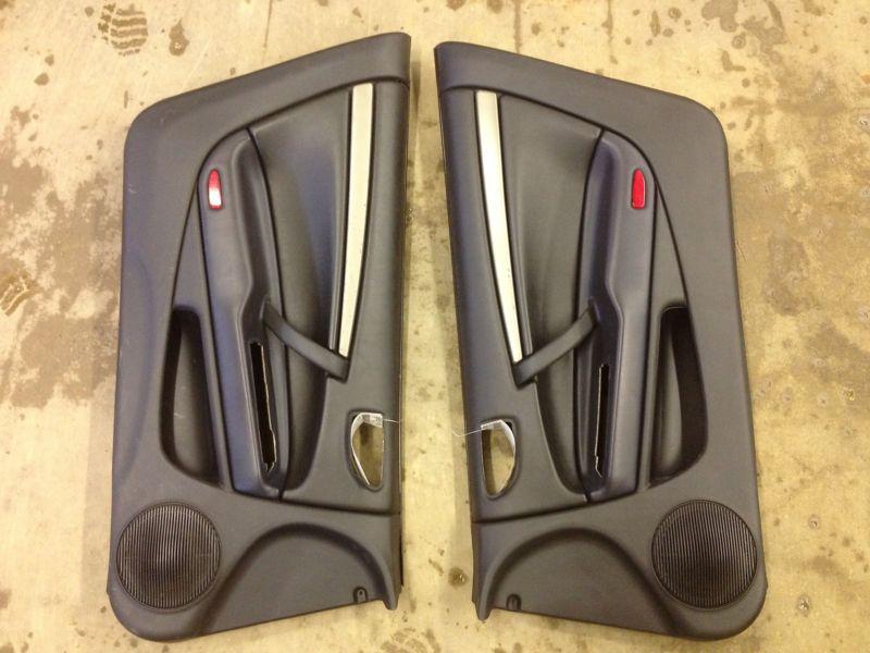 2004 mitsubishi eclipse left & right front door trim panel