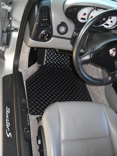 Boxster aluminum floor mats.  black with exposed metal diamond design