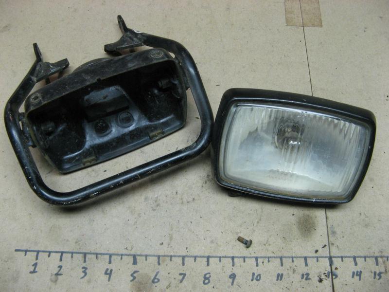 Used oem 88-02 yamaha 200 blaster headlight head light & bracket guard