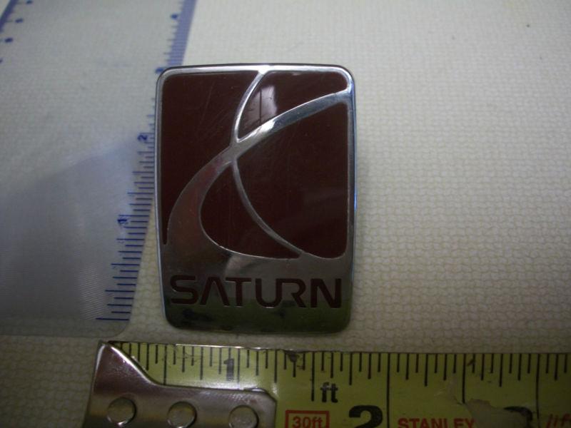 Saturn emblem script red chrome  used oem original