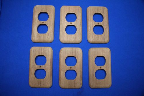 Six teak duplex electric outlet covers