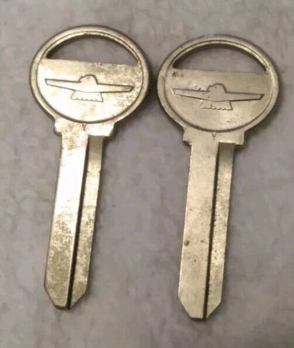 (2) vintage nos key blanks ford falcon automobile die cut embossed logo