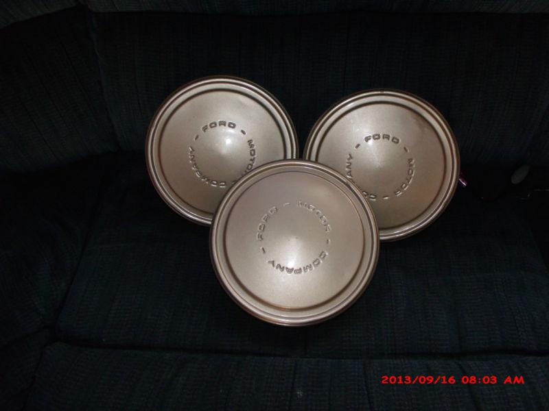 Set of 3 ford motor company hubcaps