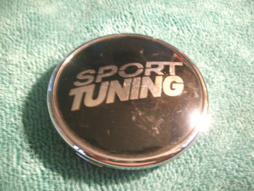 Sport tuning black-chrome wheel center cap part # c-e87 on back of hub.