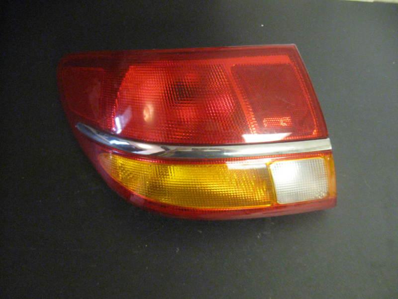 Saturn l series tail light left 00 01 02 original part l100 l200