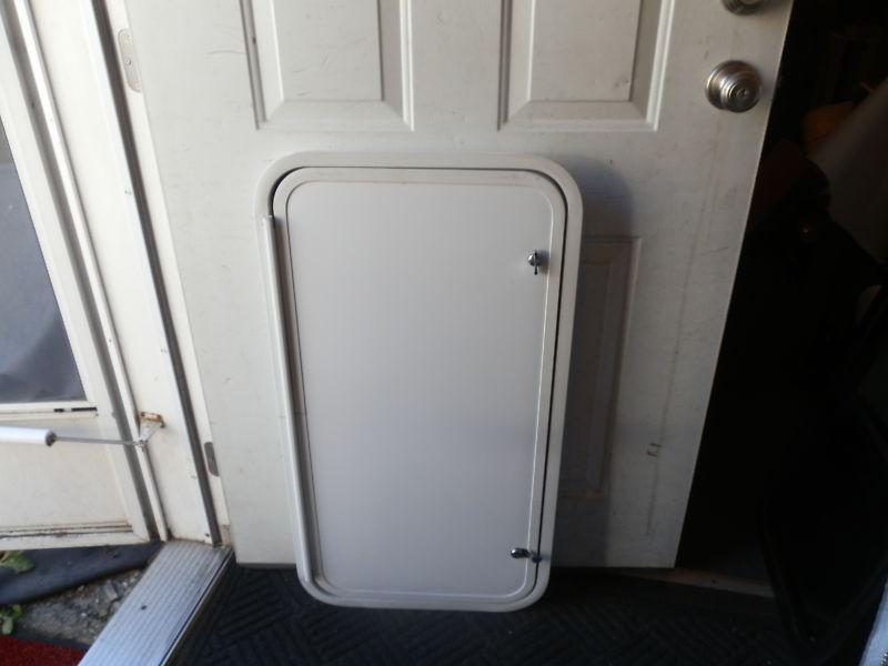 Rv cargo door r.o. 35" tall x 18" wide x 2" thick ( used )