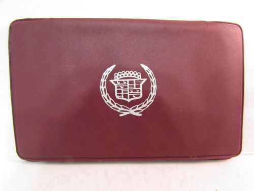 Empty cadillac holder - brick red with white logo - no keys