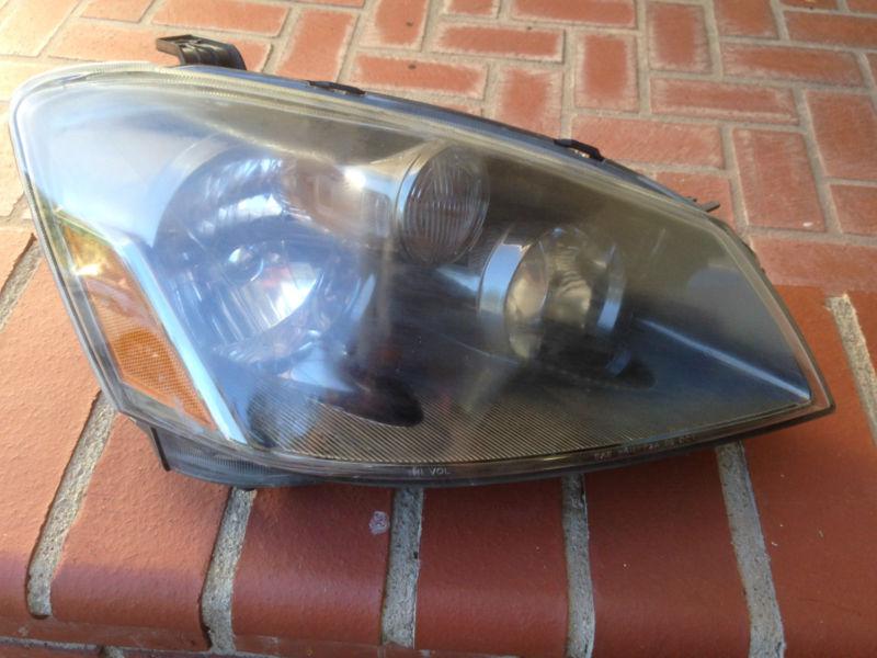 05 06 nissan altima right (passenger side) headlight oem, factory