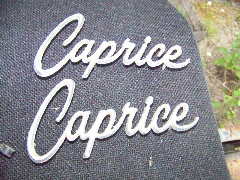 1 pair chevy caprice script orig has pitting all pins are there.