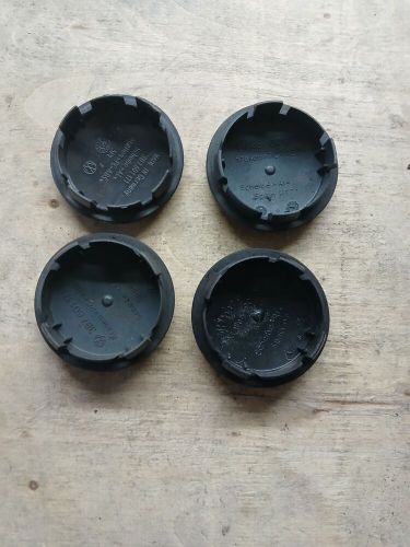 Set of 4 genuine volkswagen vw polo golf passat touran alloy wheel centre cap.