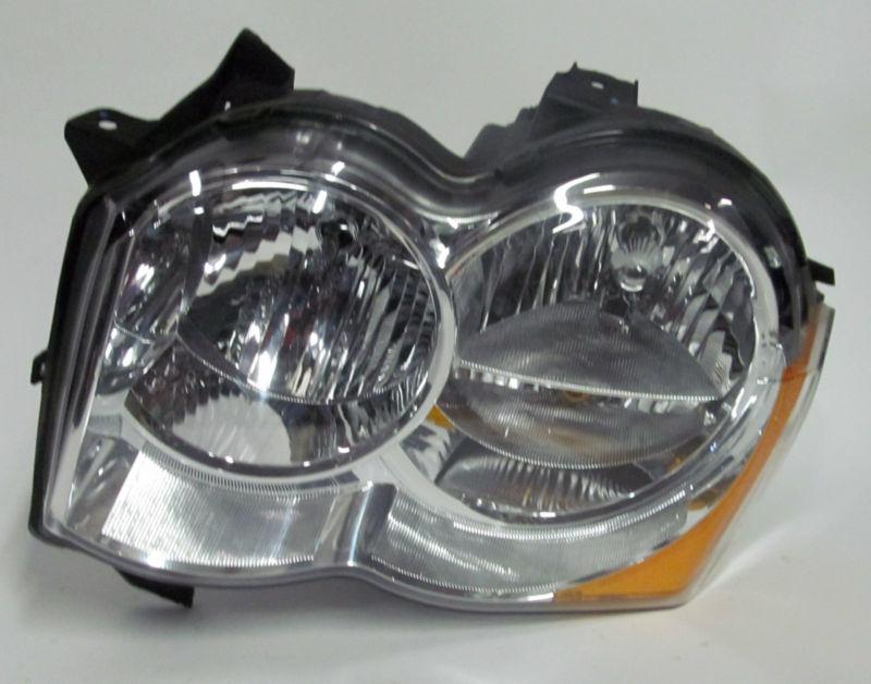 08 09 2010 jeep grand cherokee oem left halogen headlight nice!