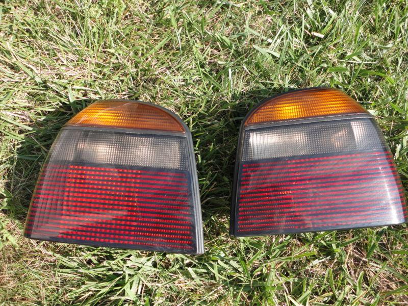 Used ome  smoked tail light set vw cabrio golf gti 93-02 mk3