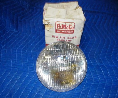 1955 ford and thunderbird, nos 6 volt sealed beam headlight in original pkg.