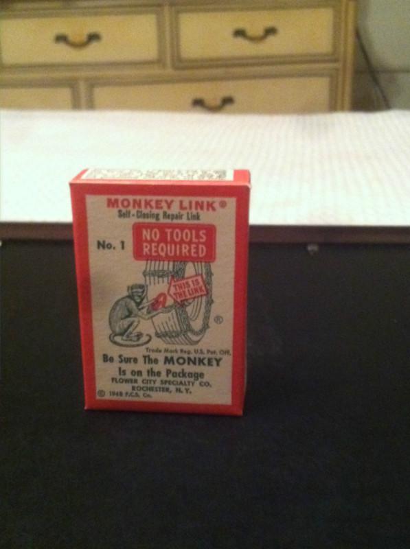 Vintage monkey link tire chain sign oil can gas pump