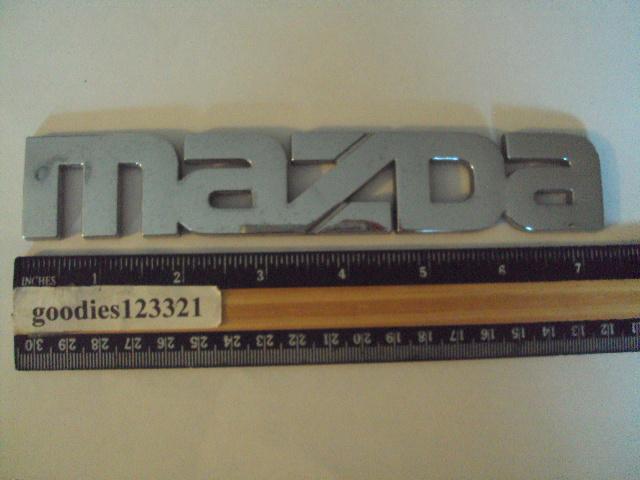 Mazda chrome emblem 7 1/4" x 1 1/4"