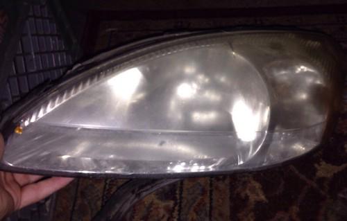 Used left driver side headlamp headlight replacement lh