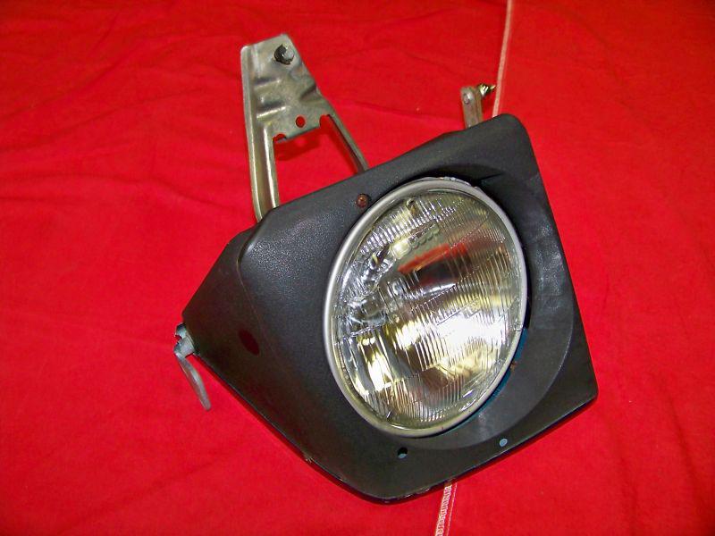 Porsche used complete  left headlight assembly for 944.