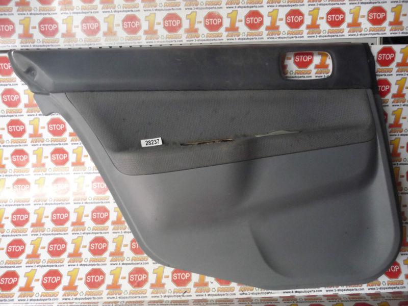 02 03 mitsubishi lancer driver/left rear door trim panel oem