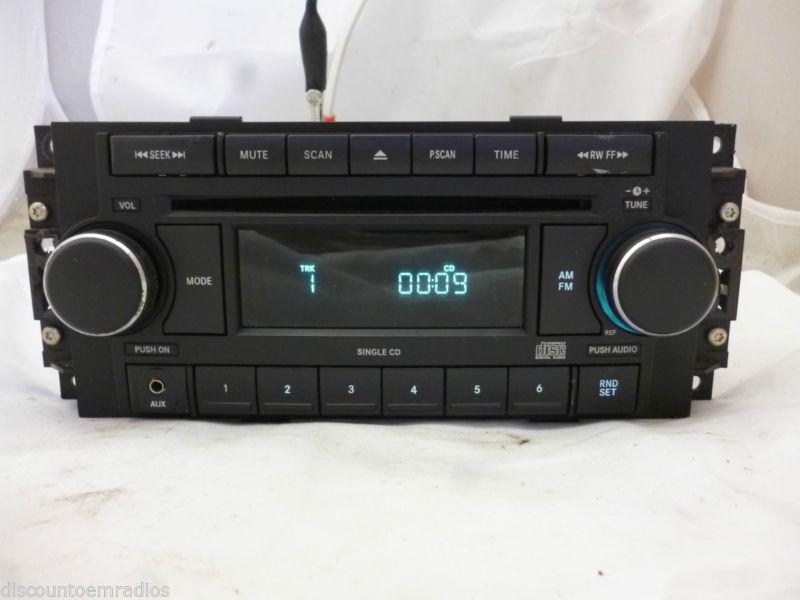 04-10 chrysler dodge jeep radio cd mp3 aux port ref p05064171ak *