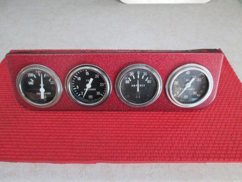 Stewart warner 4 gauge set in red mount