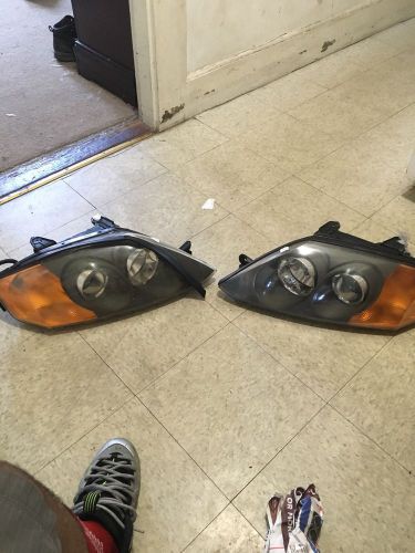 2003 hyundai tiburon head light assembly left and right