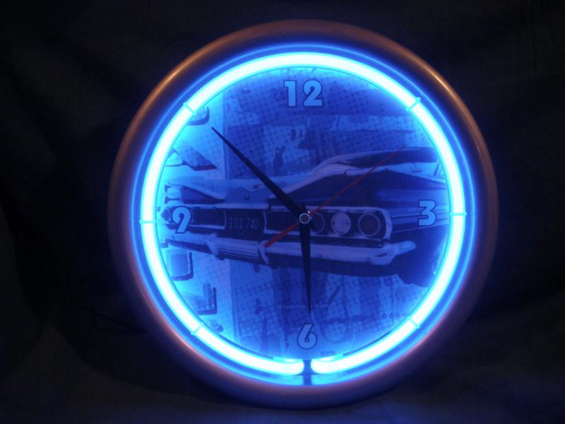 Chev theme clock ,(pic of 60) 11" round,  elec  fluorescent ring  arnd face,