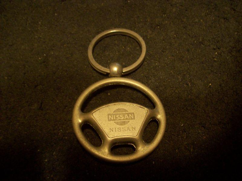 Vintage nissan  steering wheel key chain. older style.
