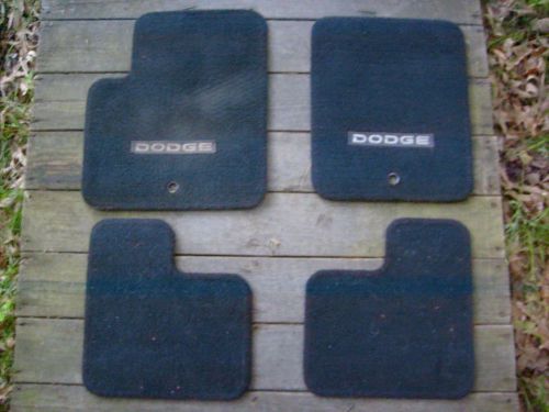 Four (4) dodge/mopar black floor mats with dodge lettering.  lqqk.