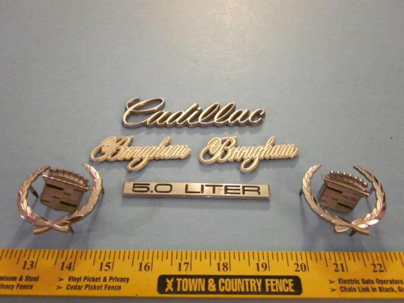 Cadillac brougham 5.0 factory chrome body emblems