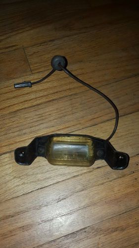 1964 chevrolet impala orginal rear license  plate light 5955195