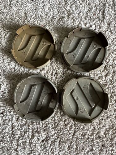 4 genuine suzuki 54mm pacific alloy wheel centre caps