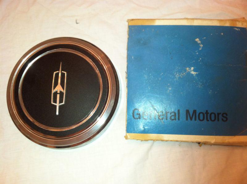 Nos general motors oldsmobile emblem of some sort; about 6-7/8" to 7" diameter