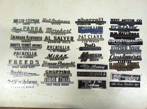 Huge lot of 33 vintage antique car dealership emblems from all over the us