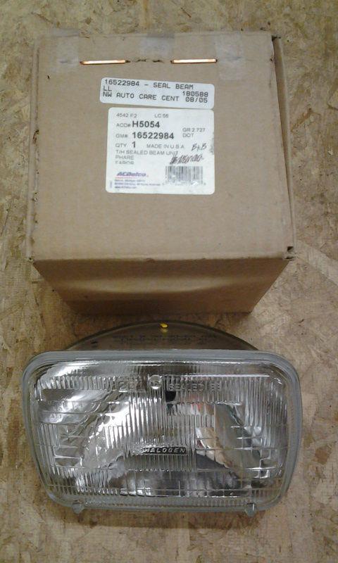 16522984  h5054  new gm ac delco headlight  gmc savana ford e350 chevy  express 