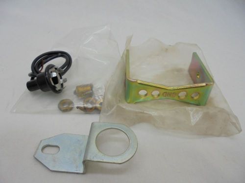 Original stewart warner light socket, bulb, bracket, bulb, and hardware - new