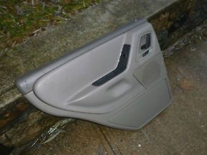 ? jeep wj 99-04 grand cherokee - rear interior door panel driver taupe