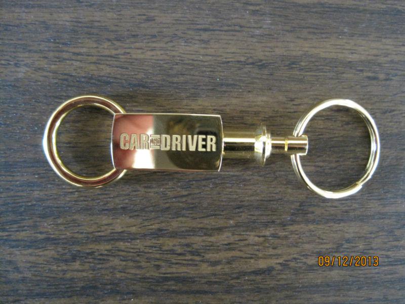 Car and driver gold key chain.  new.