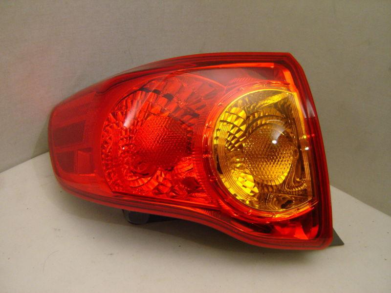 Toyota corolla left tail light 09 10 oem