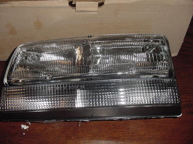 1991-93 buick park avenue left side headlight assy.  oem 16517263 nib genuine gm