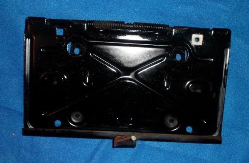 1977 cadillac seville license  plate holder with a spring in good condition.