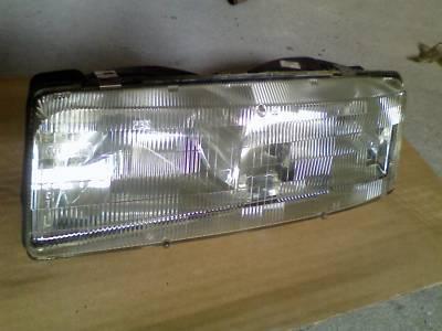 Oem new lumina trans sport silhouette headlight 90-93