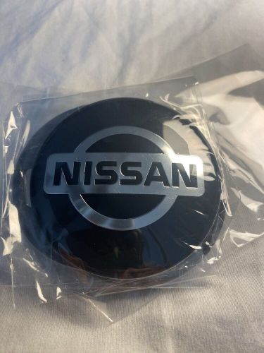 Nissan - valve caps (4), keychain and hubcap covers.  -free shipping-