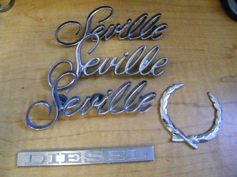 Cadillac seville chrome front fender rear trunk  5 emblems used off 80-85 car