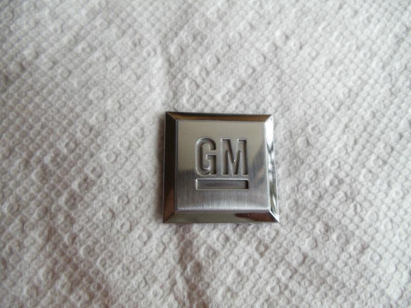 General motor "gm" square 1 1/8"  by  1 1/8"  emblem.....used in good condition