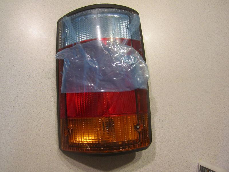 Ford econoline taillight,92,93,94. new oem lt.side  