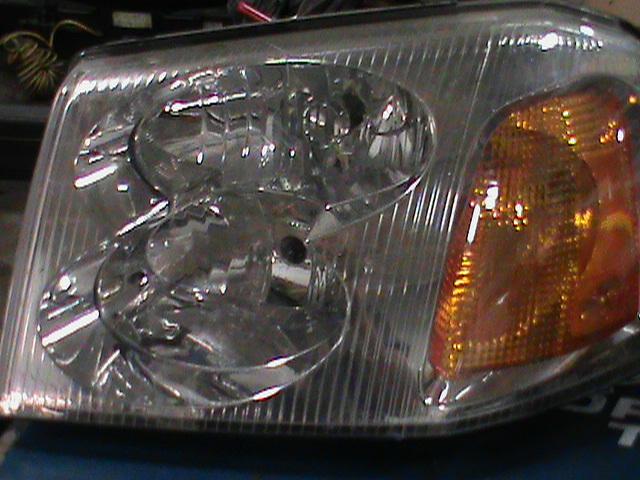 2002-09 envoy left headlight oem used