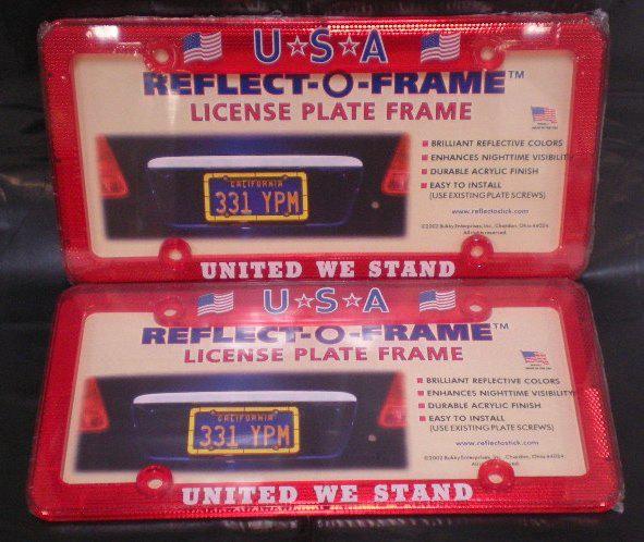 Two (2) red reflective plastic license plate frames - usa - "united we stand"